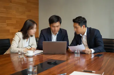 Collaborative Business Meeting Around Conference Table