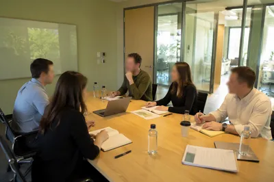 Modern Business Team Meeting at Conference Table
