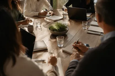 Focused Business Team Around Conference Table