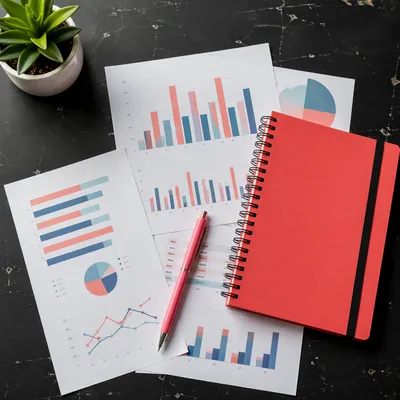 Business Plan Notebook with Charts Flat Lay