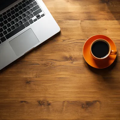 Morning Coffee and Laptop Workspace