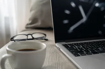 Quiet Morning Coffee and Laptop Workspace