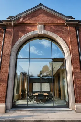 Modern Glass Conference Room in Brick Facade