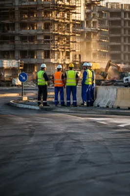 Road Construction Workers Planning at Worksite
