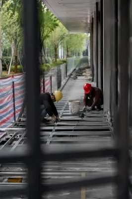 Construction Workers Installing Metal Floor Framing