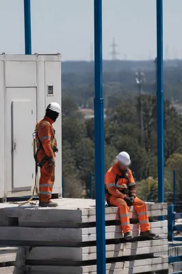 Construction Workers on Precast Concrete Slabs