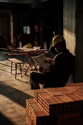 Construction Worker Break in Dramatic Sunlight
