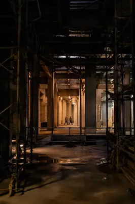 Night Construction Workers in Unfinished Building