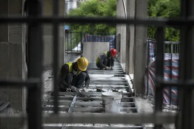 Construction Workers Installing Metal Floor Framing