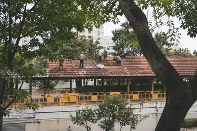 Renovation Crew on Urban Red Tile Roof
