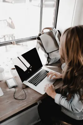 Freelancer Working at Sunlit Coworking Cafe