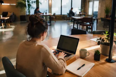 Freelancer Working in Bright Coworking Lounge