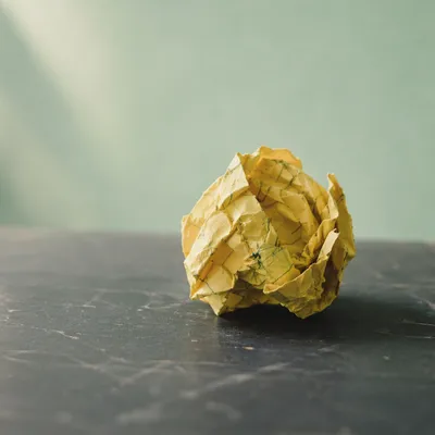 Crumpled Note on Desk for Brainstorming