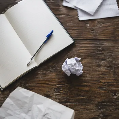 Brainstorming Desk With Crumpled Paper