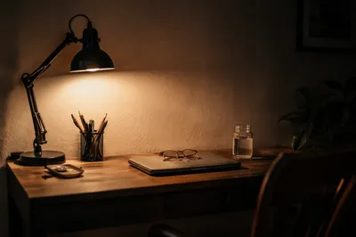Warm Desk Lamp Over Evening Workspace