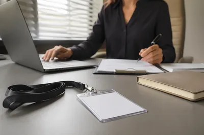 Professional Employee Badge on Modern Office Desk