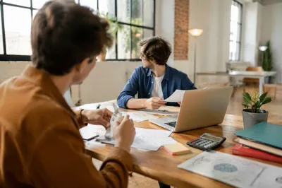 Startup Entrepreneurs Collaborating in Creative Loft Office