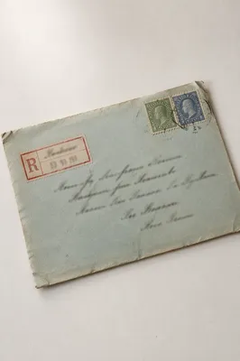 Aged Business Envelope on White Desk