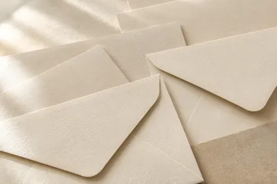Professional Correspondence Envelopes on Warm Desk