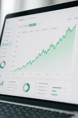Rising Financial Analytics Dashboard on Laptop