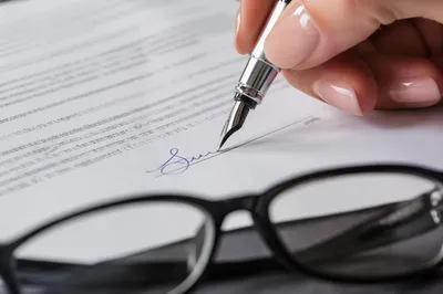 Hand Signing Business Contract With Fountain Pen