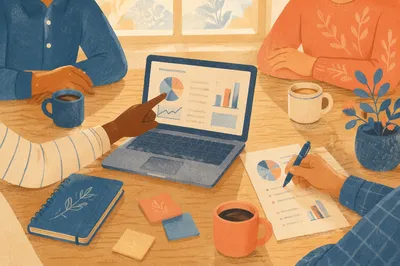 Hands Pointing at Laptop in Team Meeting