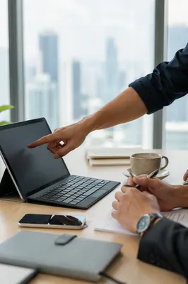 Business Team Discussing Laptop Screen