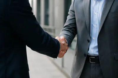 Professional Handshake After Business Agreement