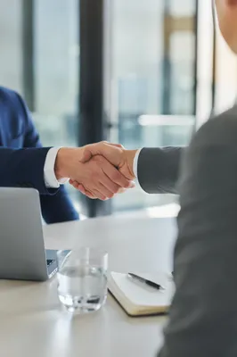 Professional Job Interview Handshake in Modern Office