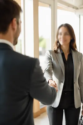 Professional Job Interview Handshake in Modern Office