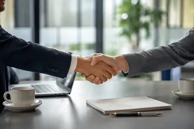 Job Interview Handshake in Modern Office