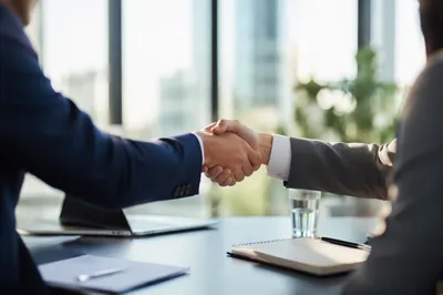 Professional Job Interview Handshake in Modern Office