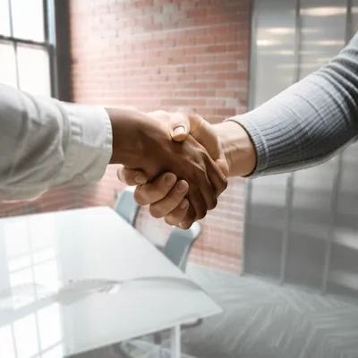 Successful Job Interview Handshake in Modern Office