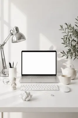 Clean White Desk With Open Laptop