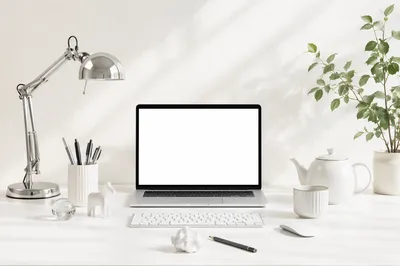 Clean White Desk with Open Laptop Workspace