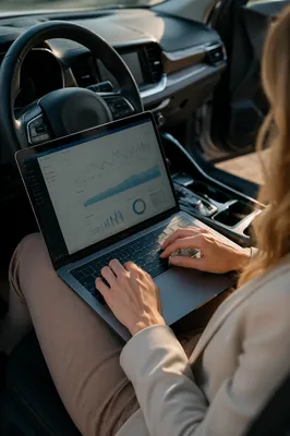 Mobile Analytics Dashboard on Laptop in Car