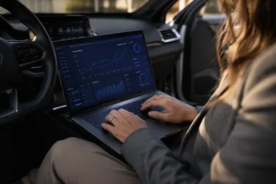 Mobile Analytics Dashboard on Laptop in Car