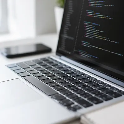 Modern Developer Laptop with Blurred Code