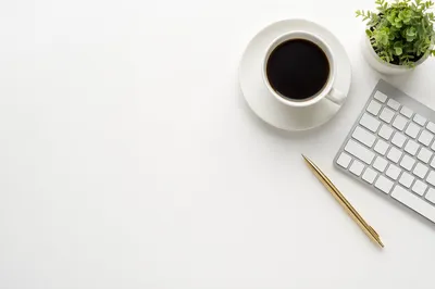 Minimalist Business Desk with Coffee and Plant
