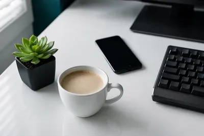 Minimalist Business Desk with Coffee and Succulent