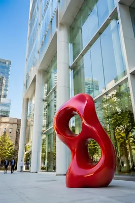Modern Glass Office Facade with Red Sculpture