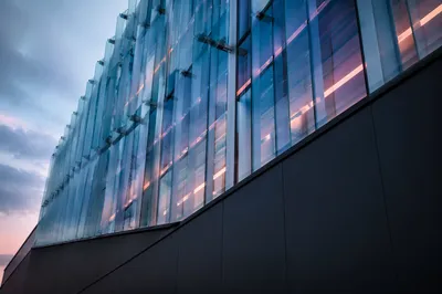 Modern Glass Office Facade at Dusk