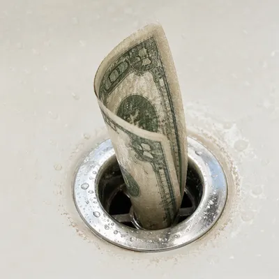 Money Disappearing Down Chrome Drain