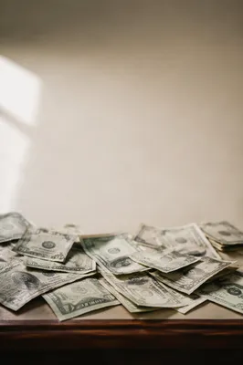 Minimal Cash Bills on Cream Tabletop