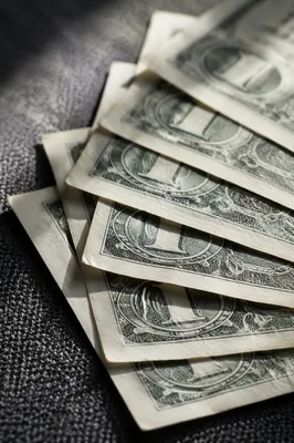 Generic Dollar Bills on Charcoal Fabric