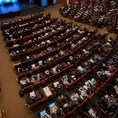 Professional Conference Audience in Modern Auditorium