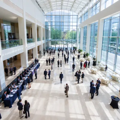 Modern Professional Networking Conference in Glass Atrium