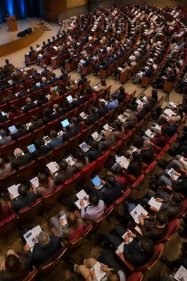 Professional Conference Audience in Modern Auditorium