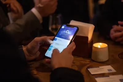 Smartphone at Warm Networking Conference Table