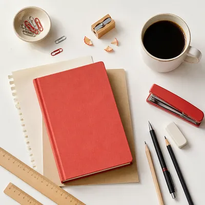 Organized Office Desk with Notebook and Coffee